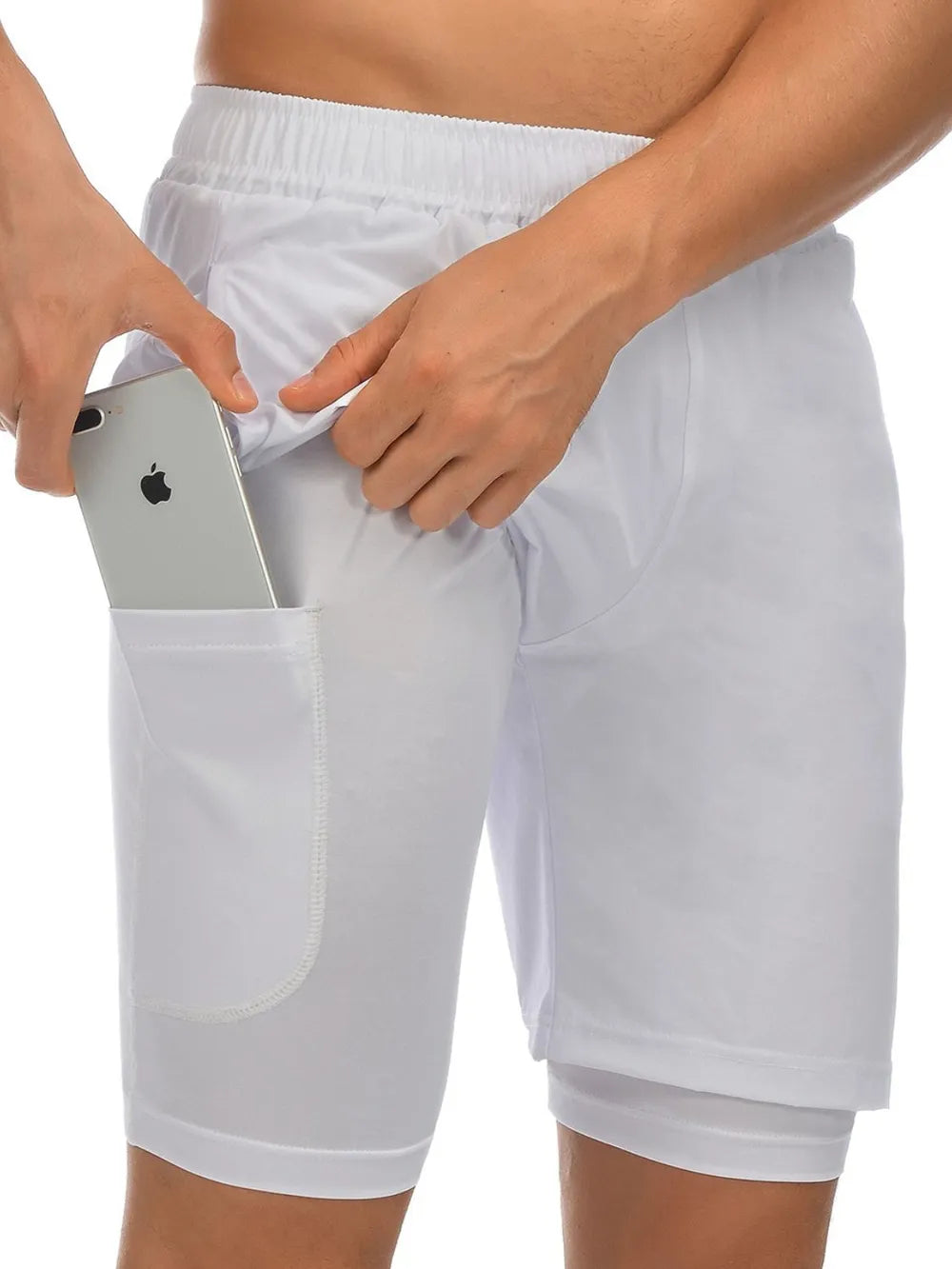 Trendsi white comfortable athletic shorts with side pocket holding a smartphone