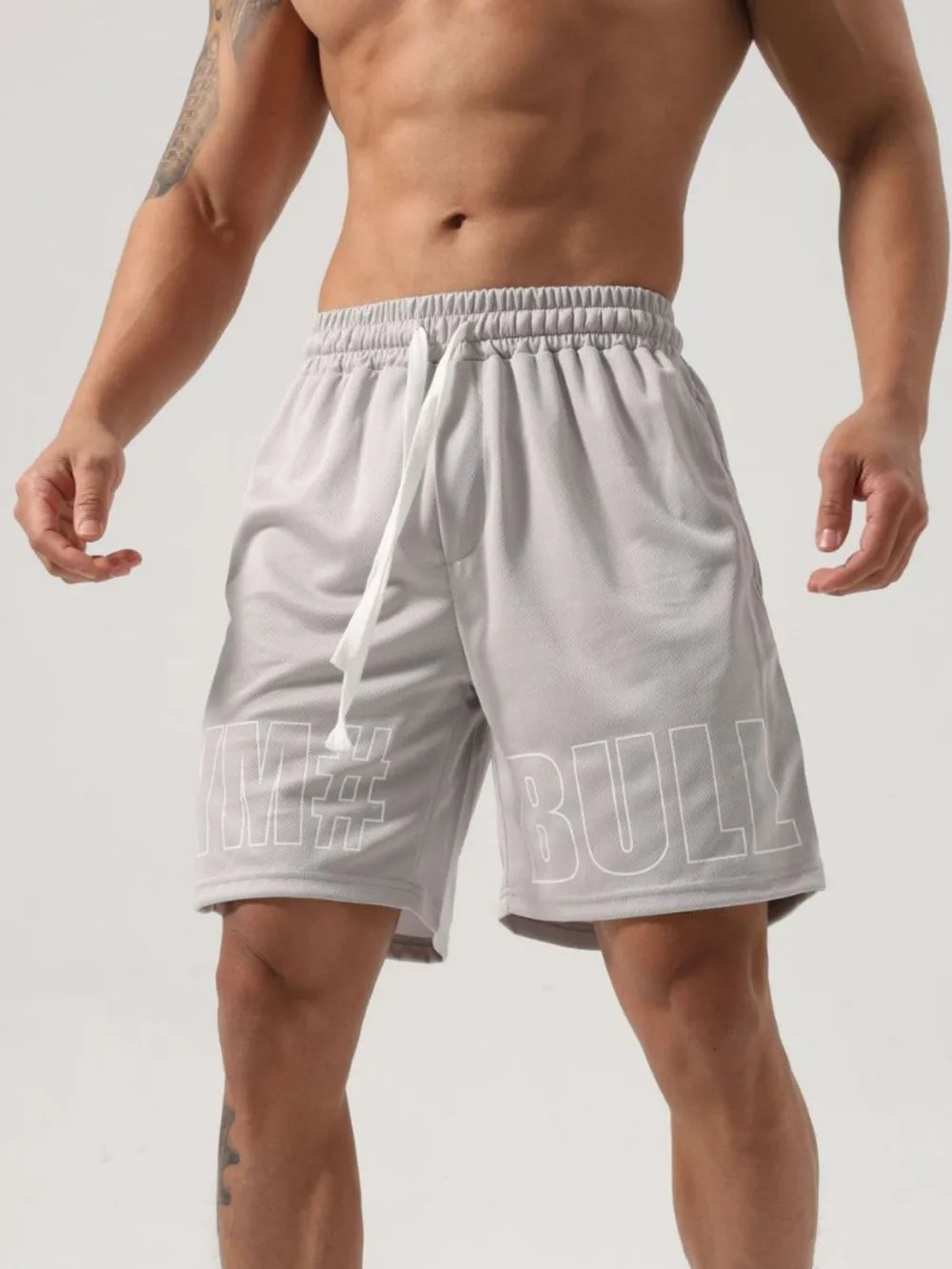 Trendsi gray drawstring gym shorts for men with elastic waistband and bold text design
