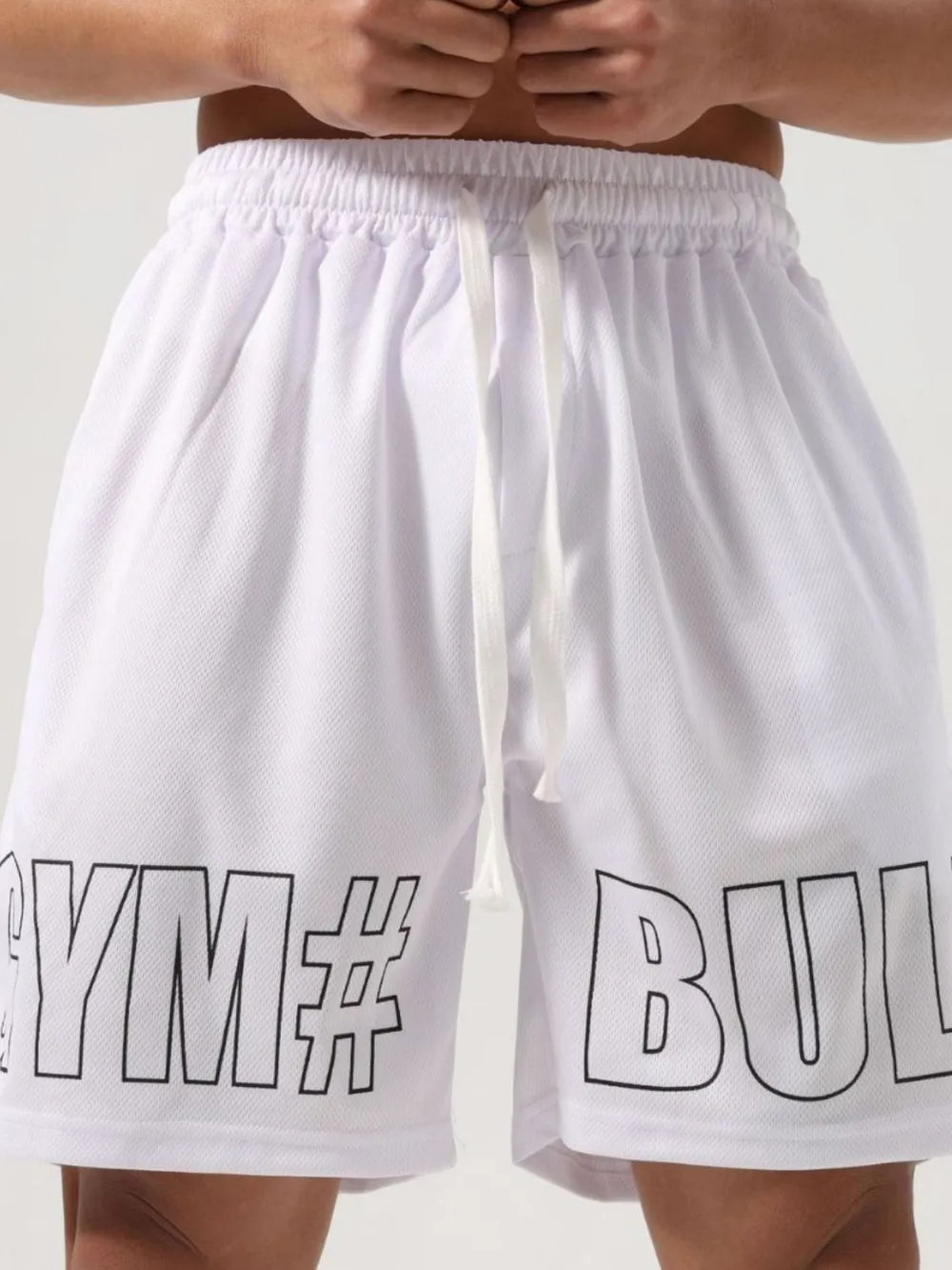 Trendsi white drawstring gym shorts for men with black bold text design on front