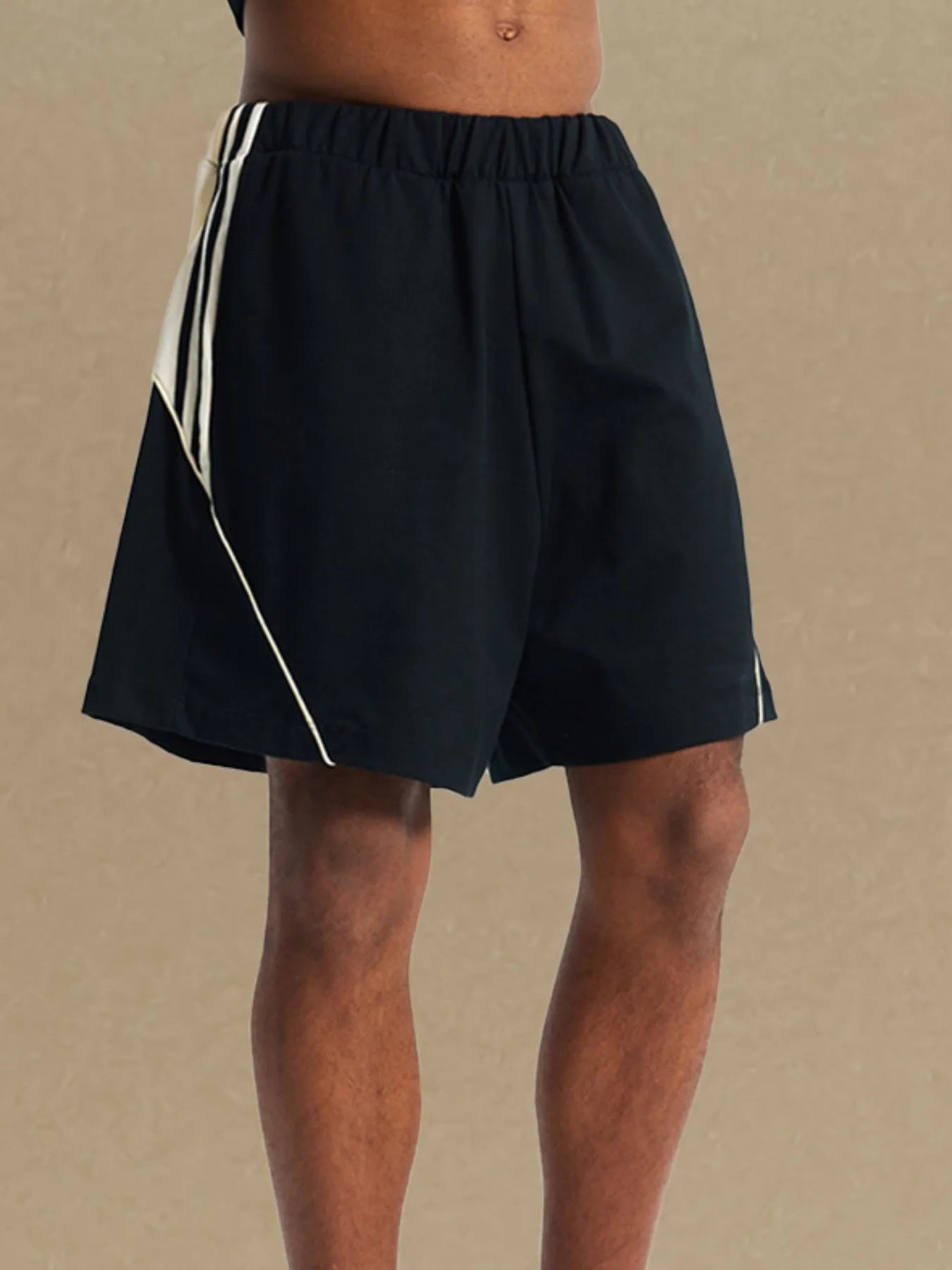 Trendsi comfortable men's sport shorts in black with white side stripes and elastic waistband