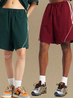 Trendsi comfortable men's sport shorts in green and maroon with white stripes worn by two models