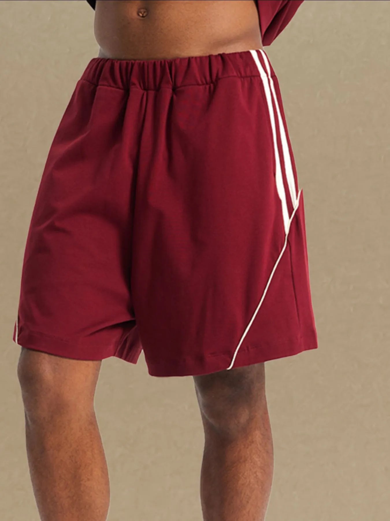 Comfortable men's sport shorts in maroon with white stripes by Trendsi for active wear