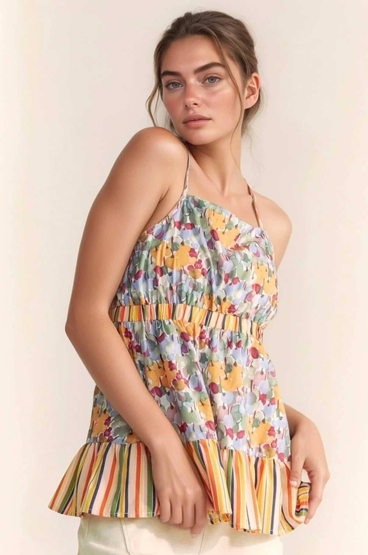 Trendsi floral smocked sleeveless top with colorful floral print and striped ruffle hem