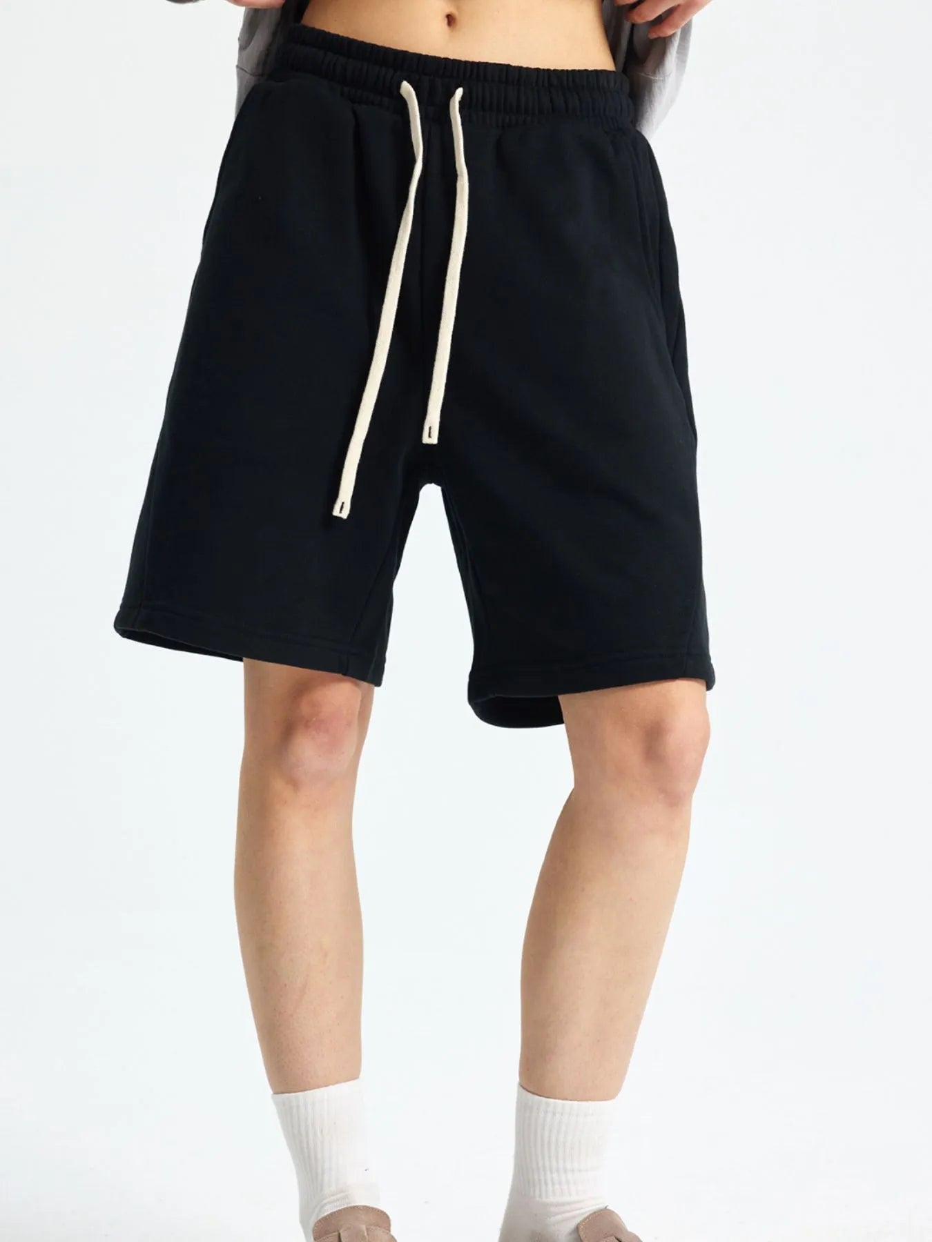 Trendsi lightweight drawstring shorts men in black with white drawstrings and side pockets