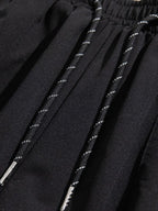 Close-up of black Trendsi cargoshorts waistband with drawstring showing men's summer shorts with pockets