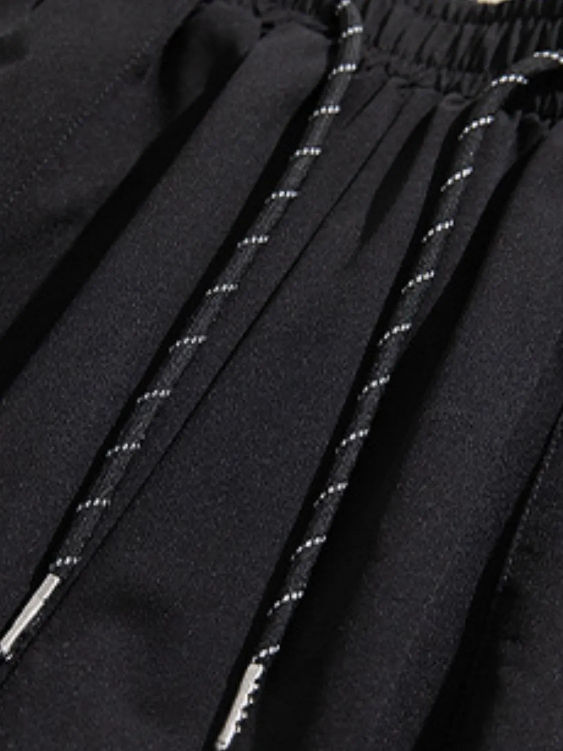 Close-up of black Trendsi cargoshorts waistband with drawstring showing men's summer shorts with pockets